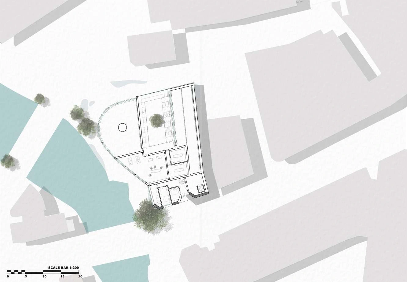 Lower-level site plan showing the dance studio beside the river and existing buildings.