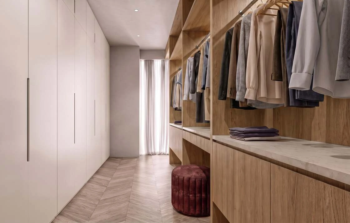 Warm timber walk-in wardrobe render with full-height white cabinets and a marble-topped island.