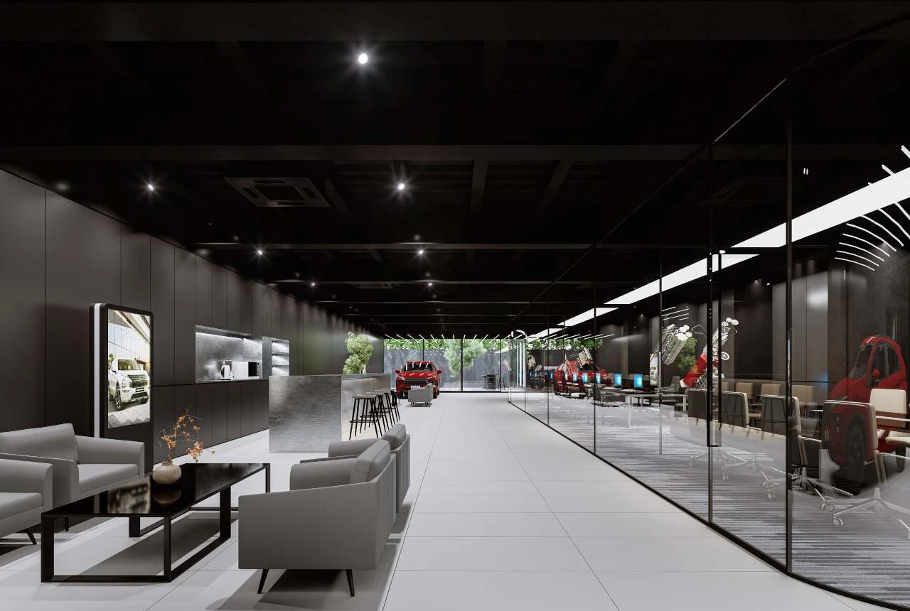 Long interior view through the Mitsubishi showroom with lounge seating, glass office and vehicles.